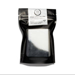 Handmade Coconut Oil Soap in a reusable bag, made with activated charcoal, tea tree and lemongrass essential oils